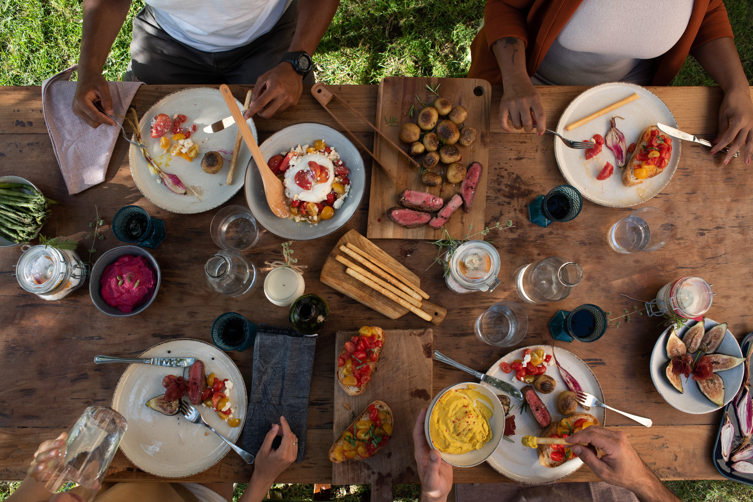 Top View of Friends Eating Food at the Table